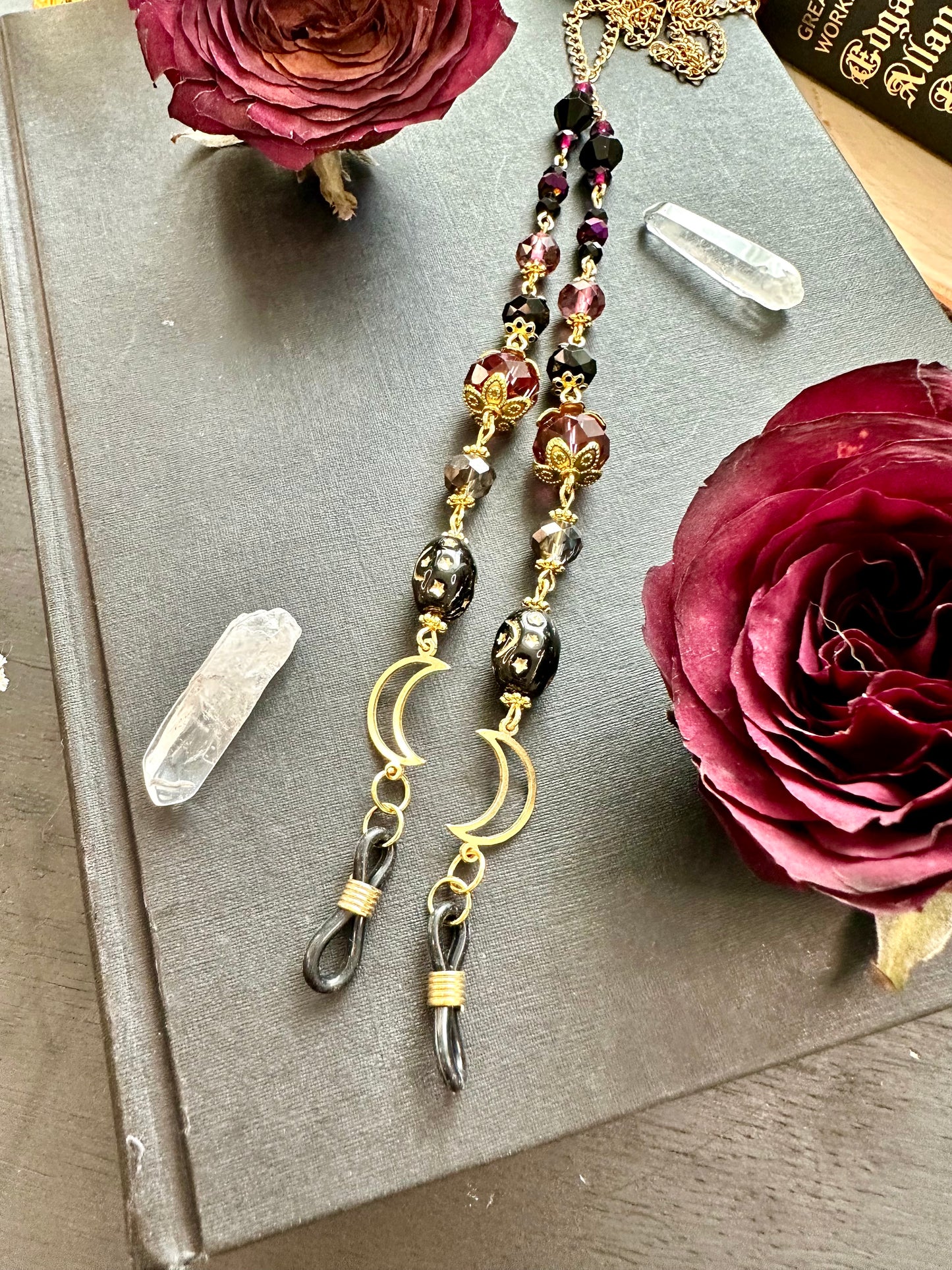 Purple and black moon eye glasses holders