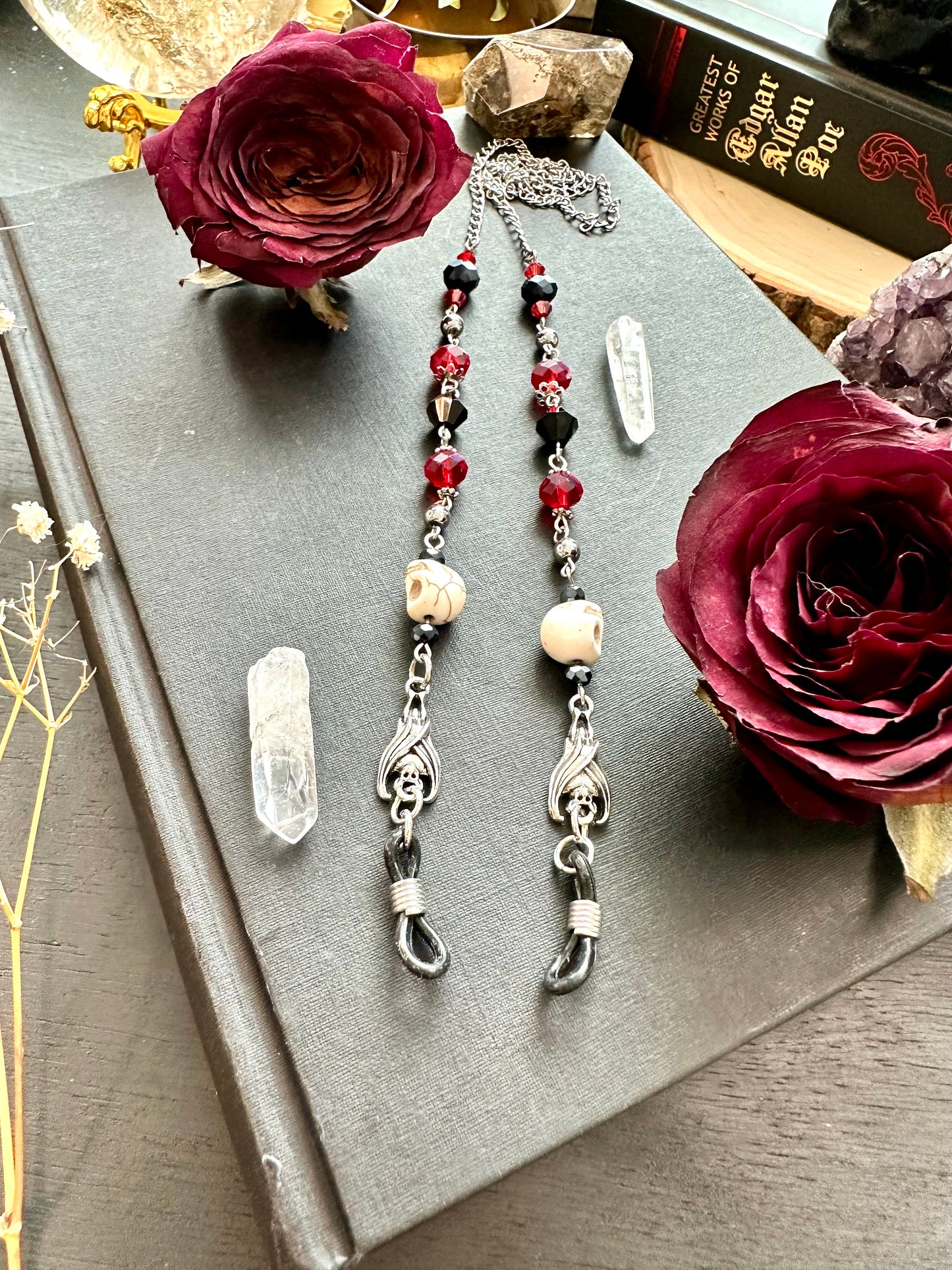 Red and black bat and skull eye glasses holders