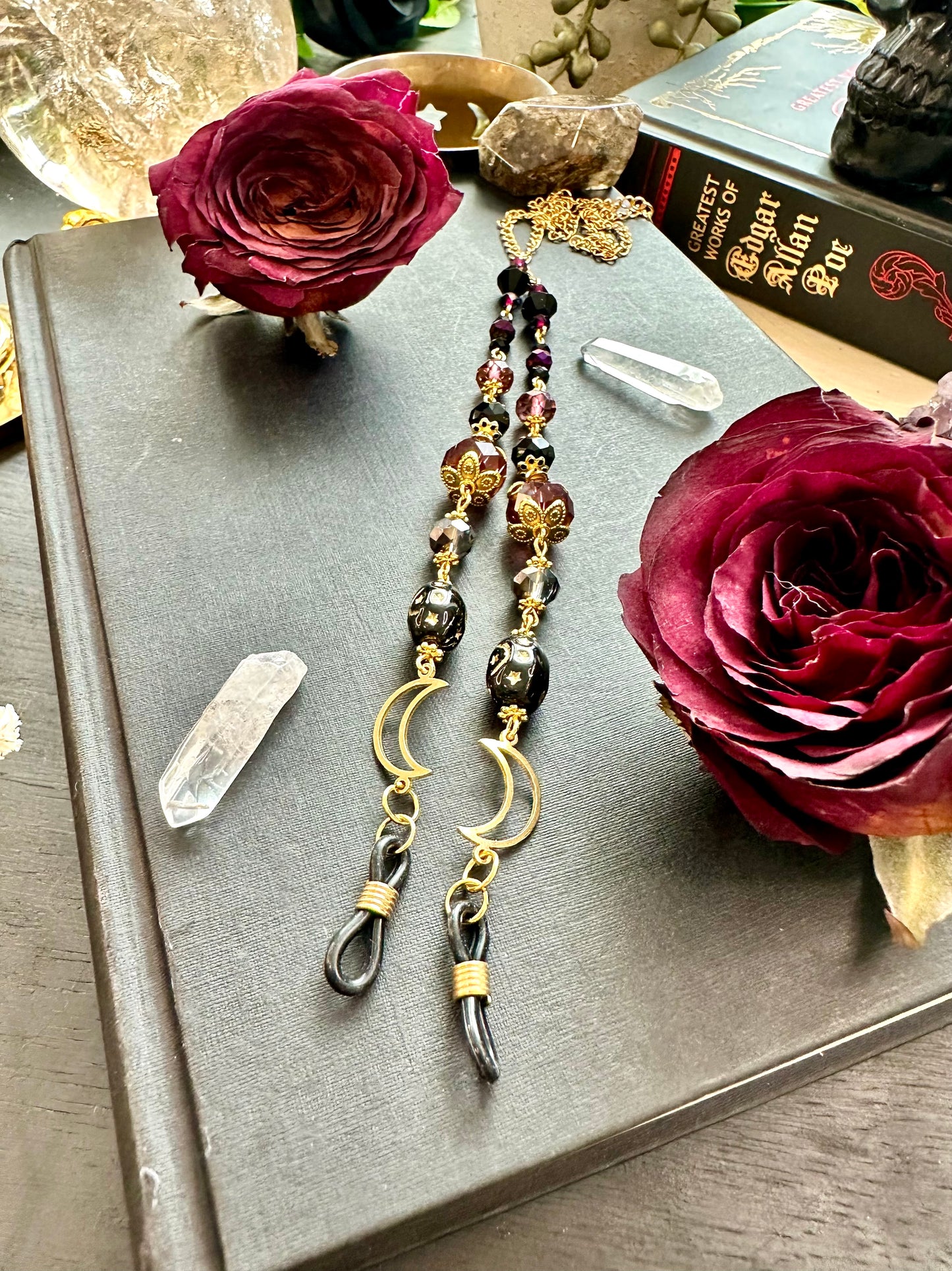 Purple and black moon eye glasses holders