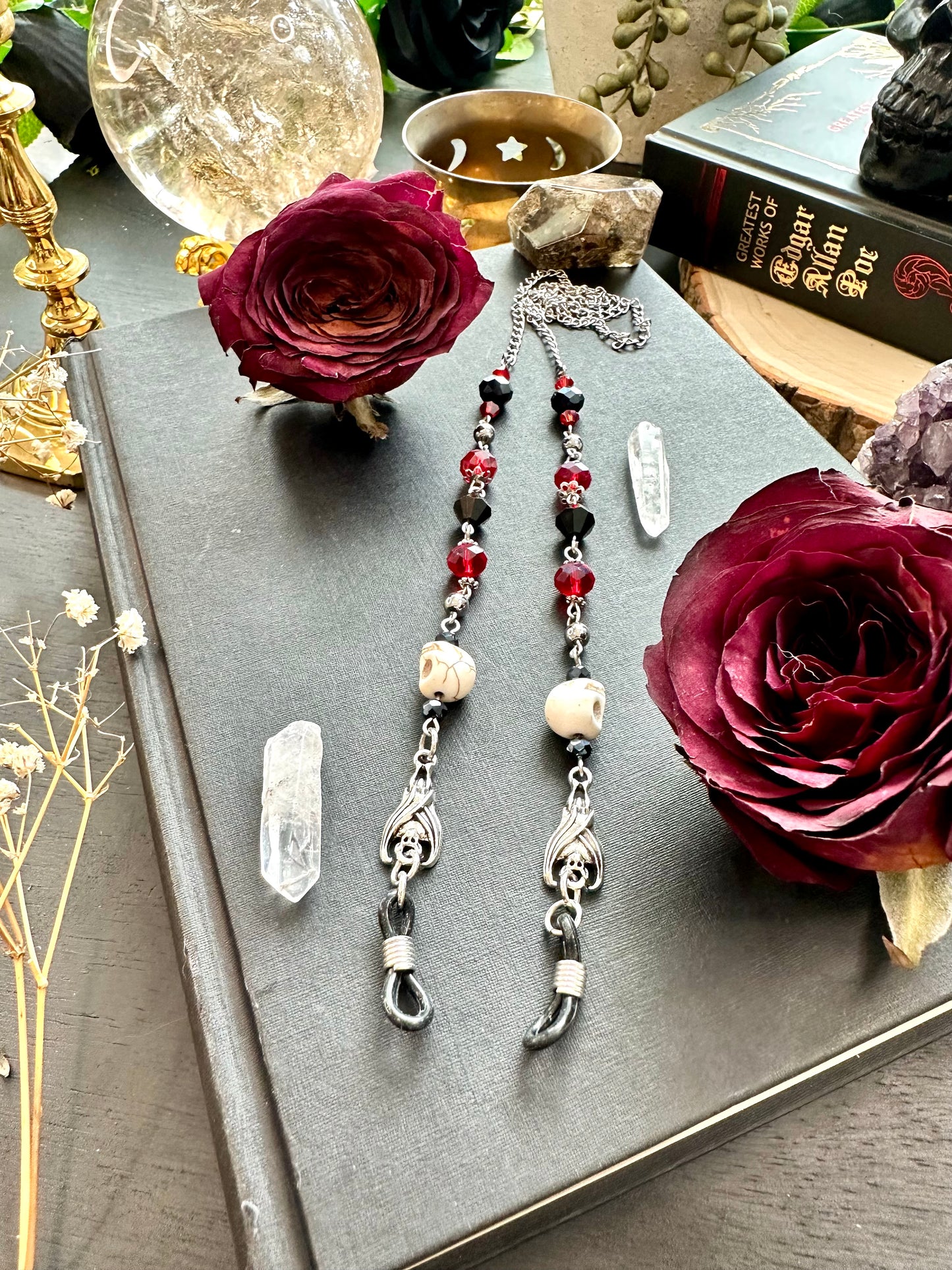 Red and black bat and skull eye glasses holders