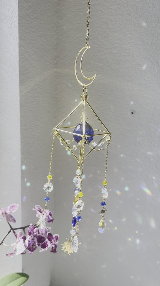 Blue and yellow “whimsygoth” celestial sun-catcher