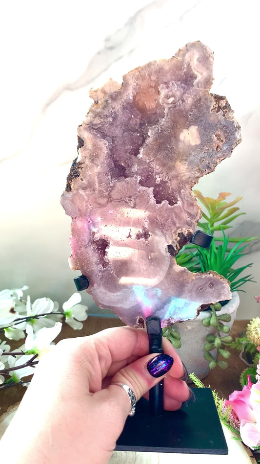 Pink amethyst slab in stand